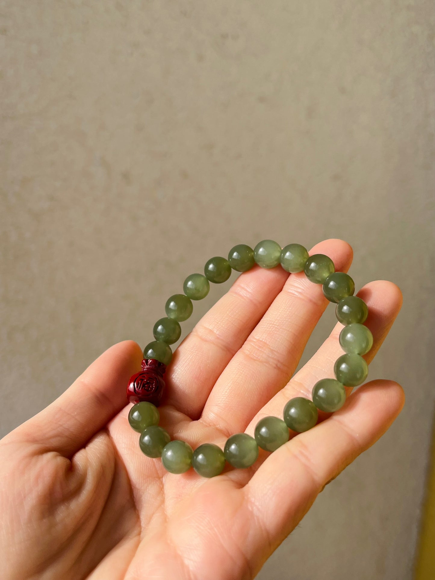 Bracelet with 8mm Icy Green Jade Beads and a Cinnabar Lucky Bag, 和田冰湖水绿珠加朱砂福袋手串