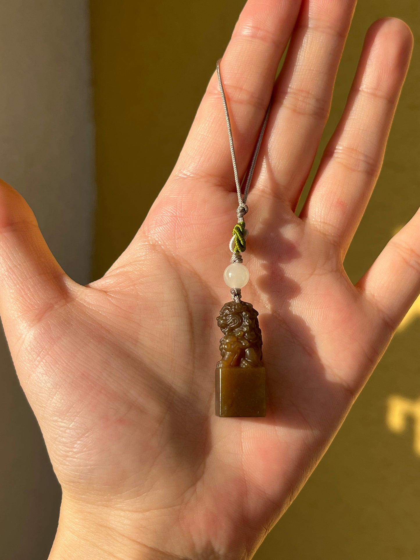 Handmade Phone Charm with a Hand Carved Brown Hetian Jade Lion，手雕和田糖玉狮子吊坠