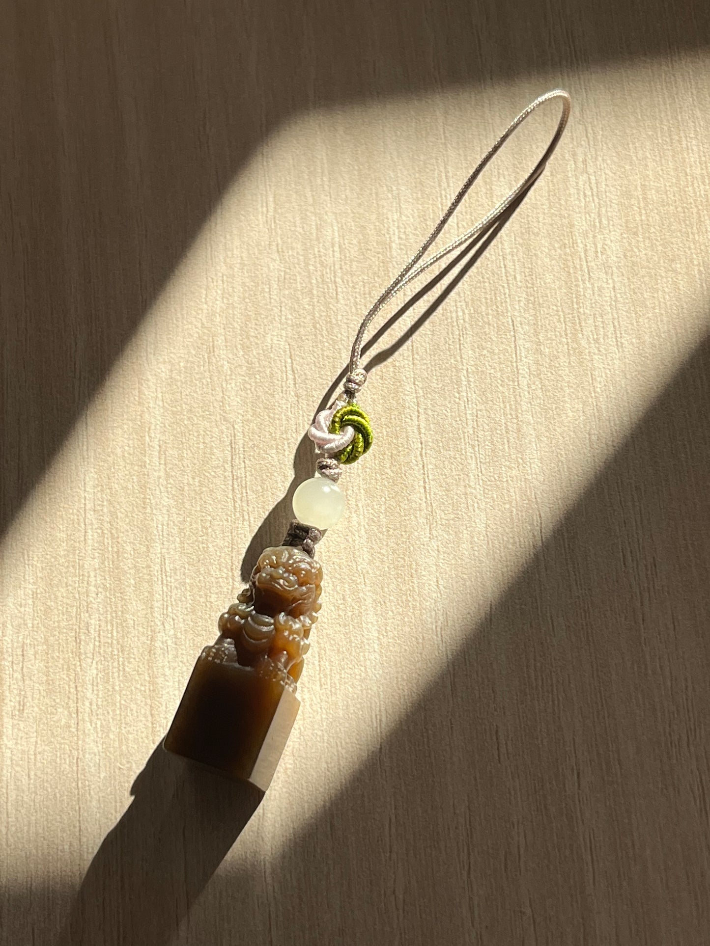 Handmade Phone Charm with a Hand Carved Brown Hetian Jade Lion，手雕和田糖玉狮子吊坠