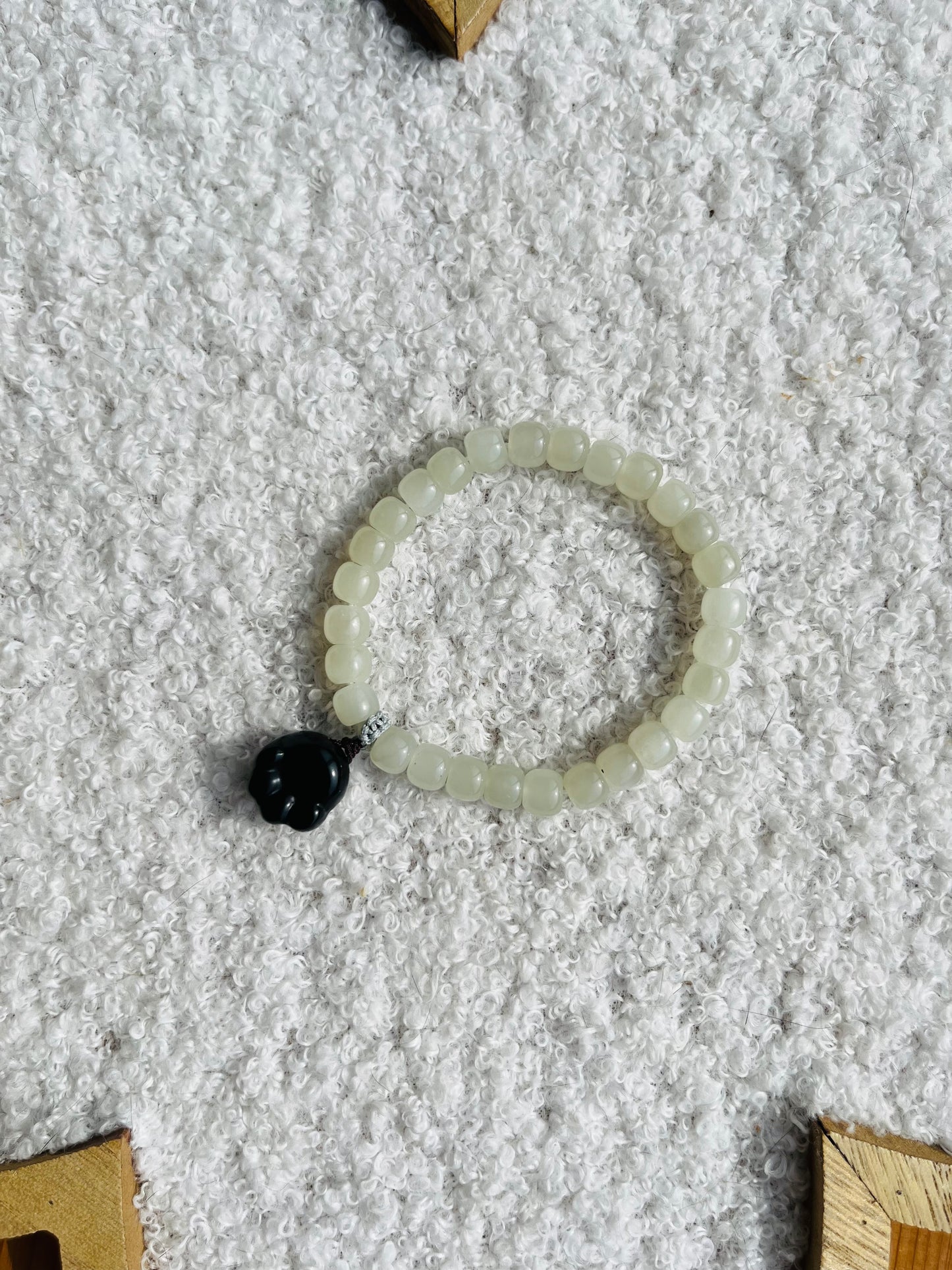 White Jade Bracelet with 6mm x 4mm Beads and a Cute Black Jade Cat Paw