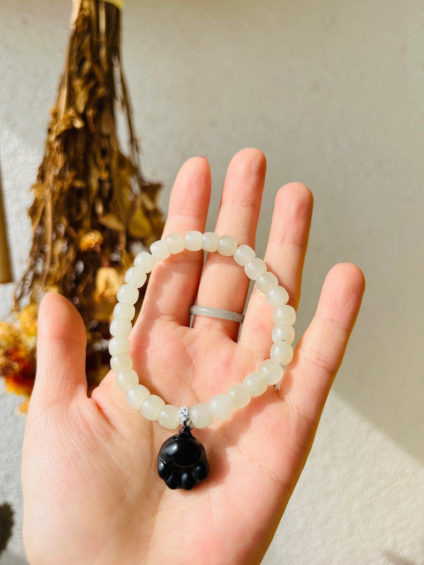 White Jade Bracelet with 6mm x 4mm Beads and a Cute Black Jade Cat Paw