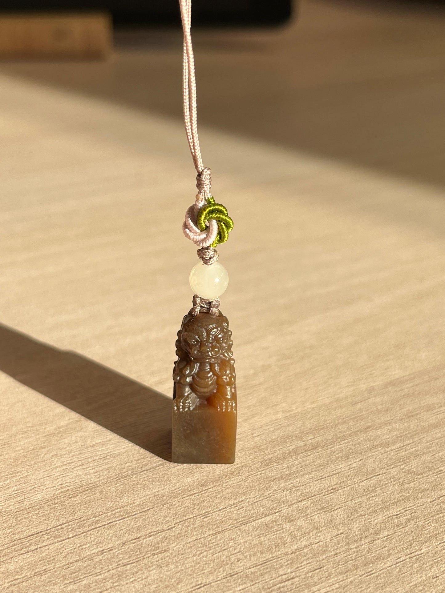 Handmade Phone Charm with a Hand Carved Brown Hetian Jade Lion，手雕和田糖玉狮子吊坠