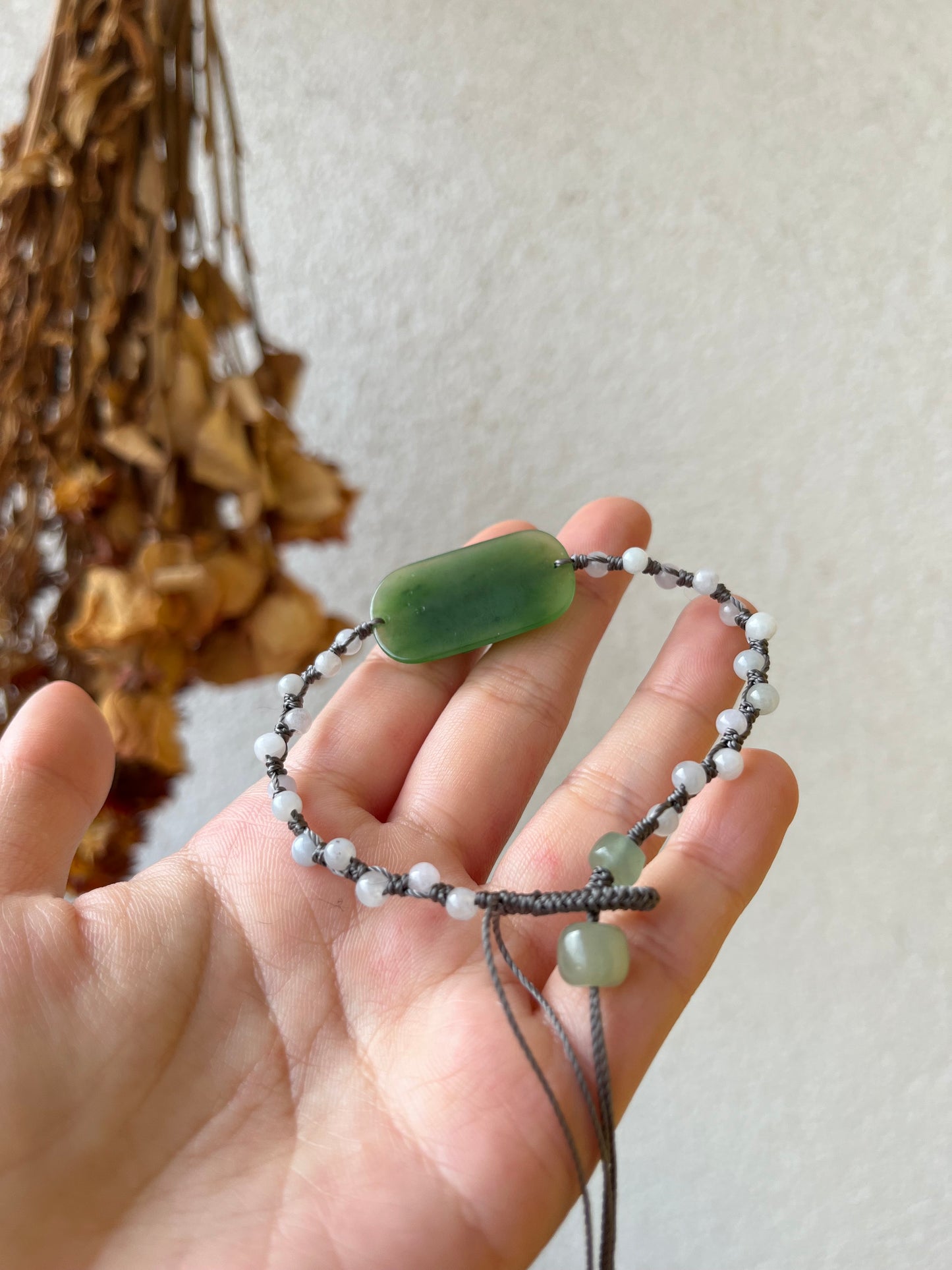 Hand-woven Charm Bracelet with a Hand Carved Green Jade Peony