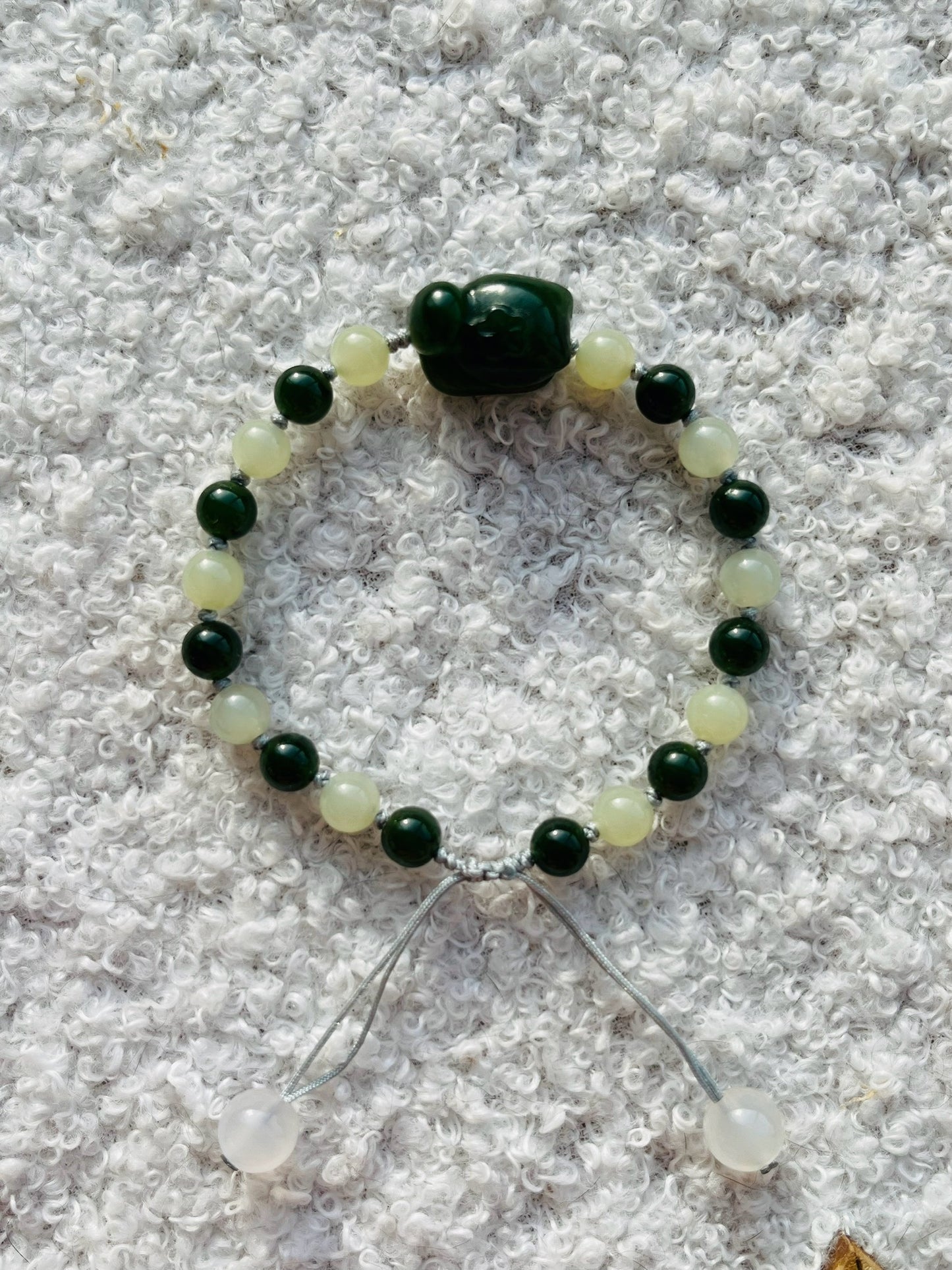 Handmade Bracelet with 6mm Green and Yellow Jade Beads and Hand Carved Cat