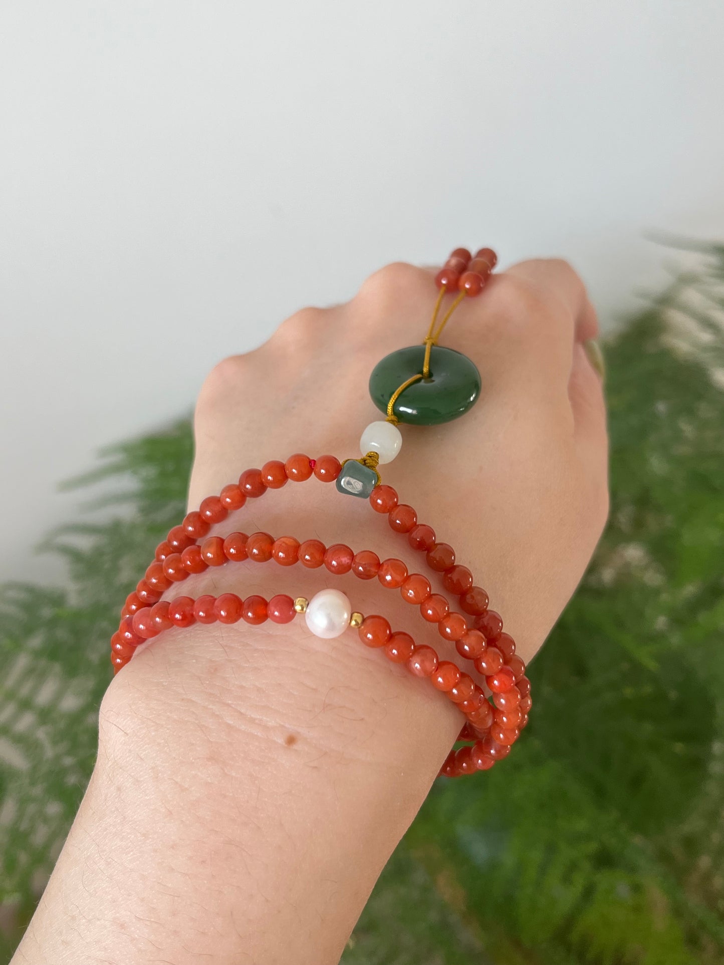 Multi-Function Three Loop Southern Red Agate Beaded Bracelet with a Green Jade PI pendant (ping an kou), 南红多圈手串加碧玉平安扣