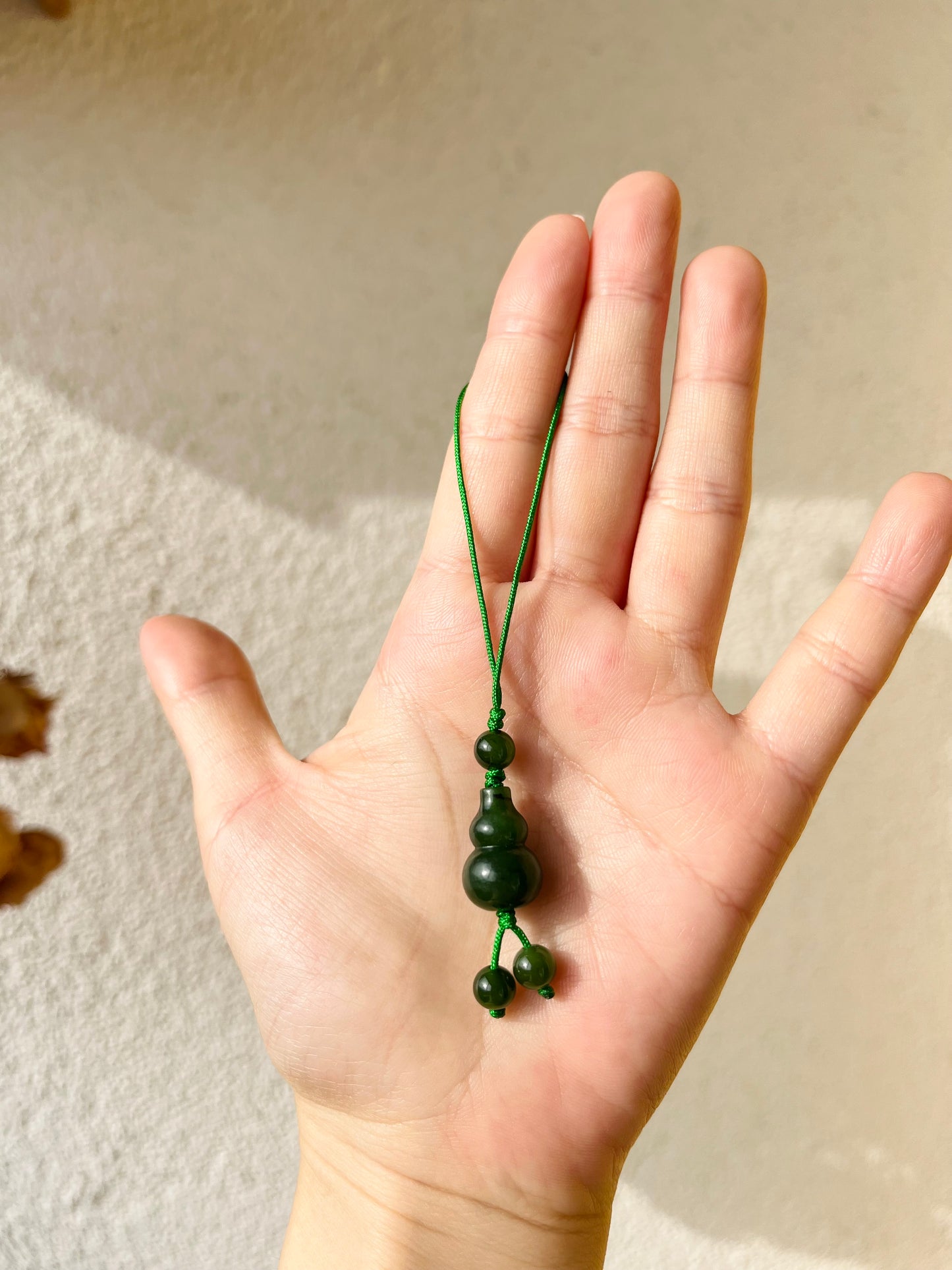 Handmade Phone Charm with a Carved Hulu