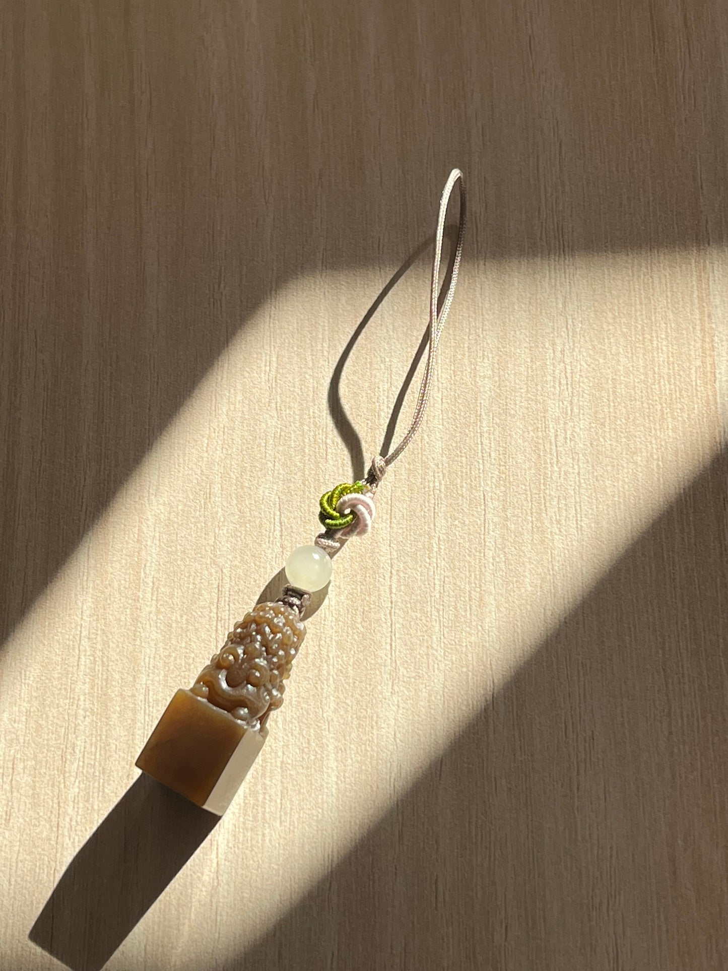 Handmade Phone Charm with a Hand Carved Brown Hetian Jade Lion，手雕和田糖玉狮子吊坠