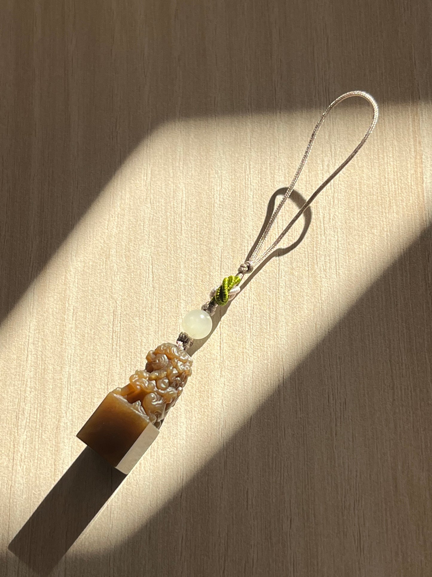 Handmade Phone Charm with a Hand Carved Brown Hetian Jade Lion，手雕和田糖玉狮子吊坠