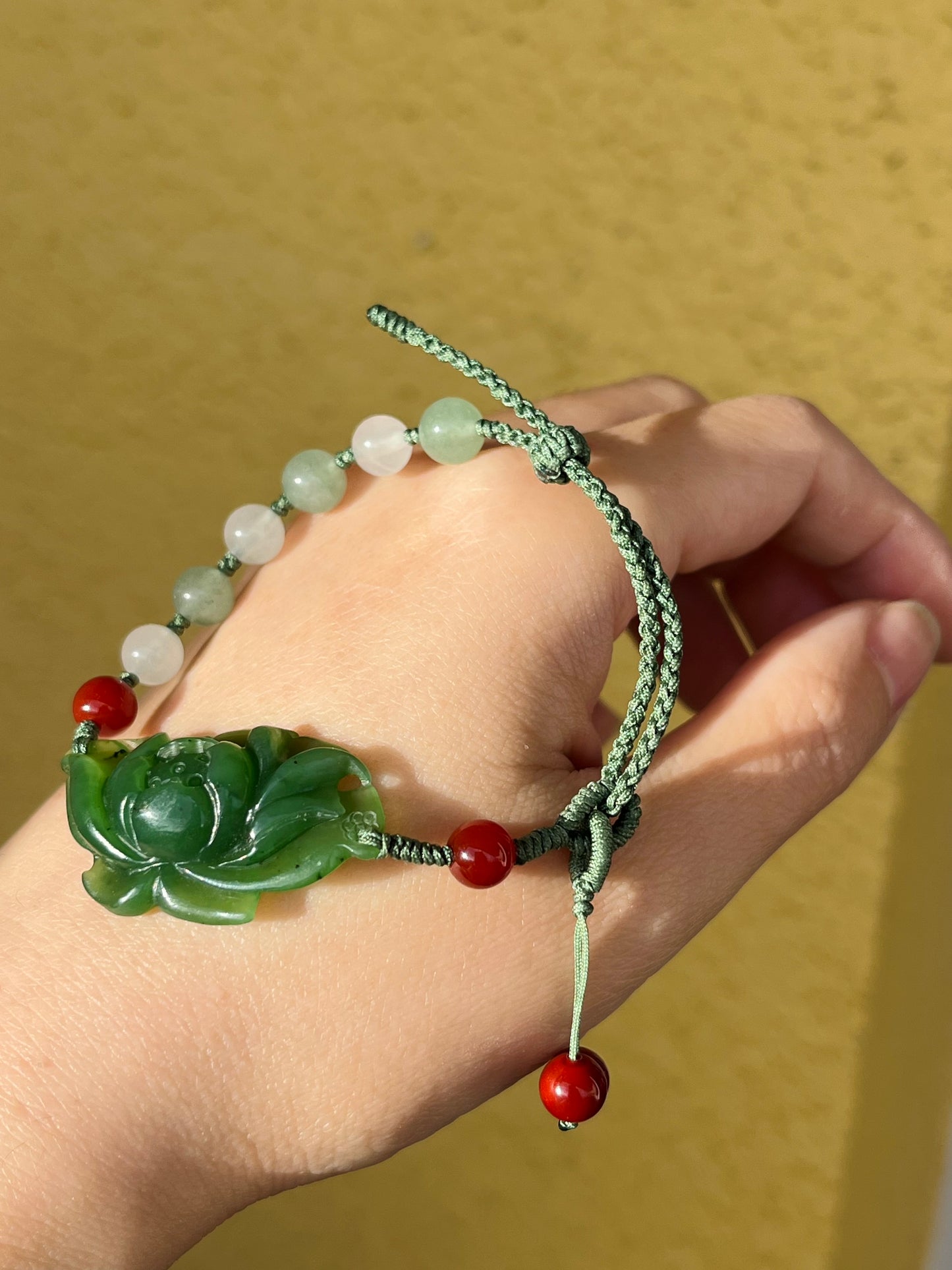 Handwoven Bracelet with a Handcarved Green Jade Lotus Flower, 手编和田碧玉莲花手牌