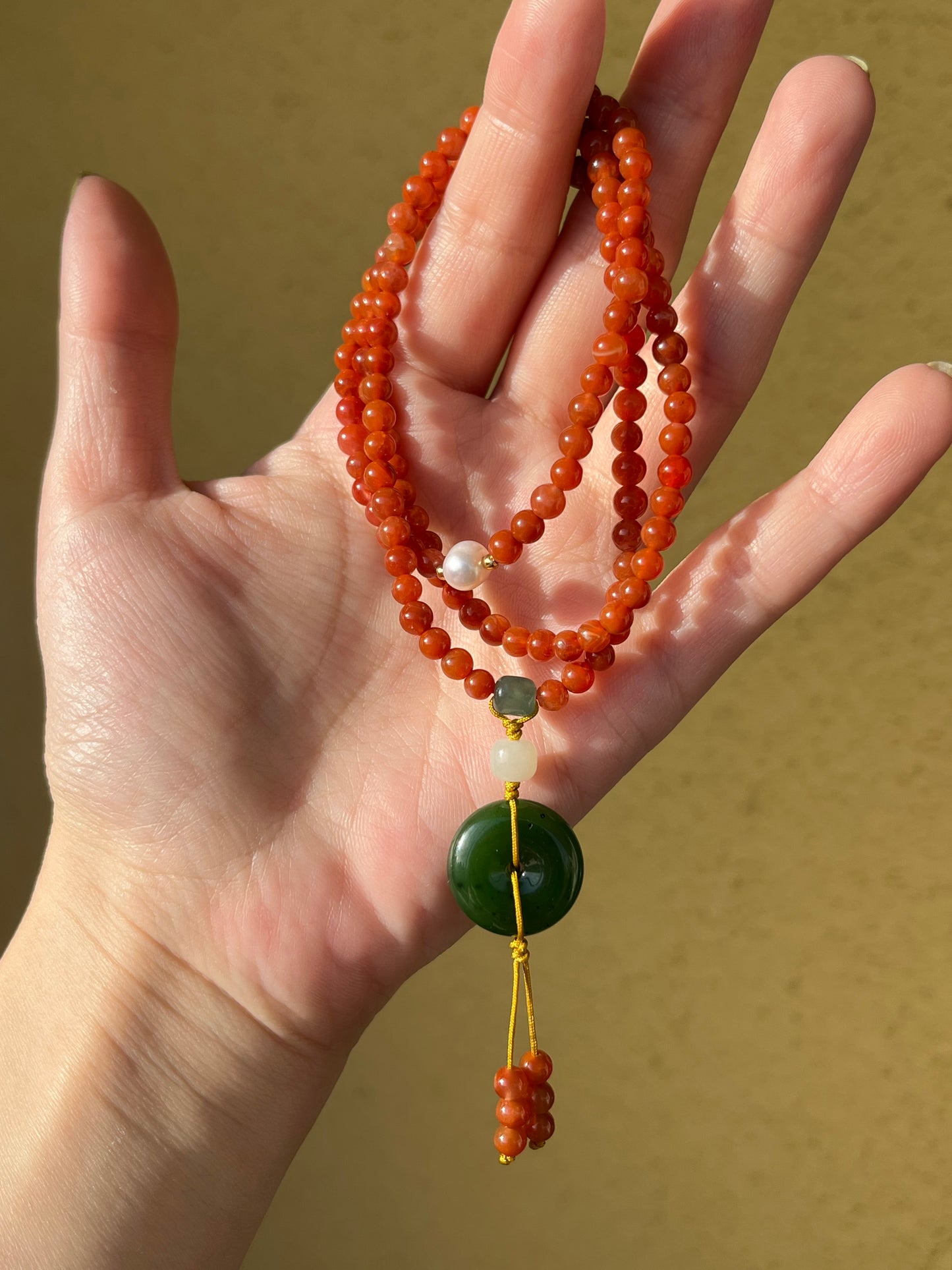 Multi-Function Three Loop Southern Red Agate Beaded Bracelet with a Green Jade PI pendant (ping an kou), 南红多圈手串加碧玉平安扣