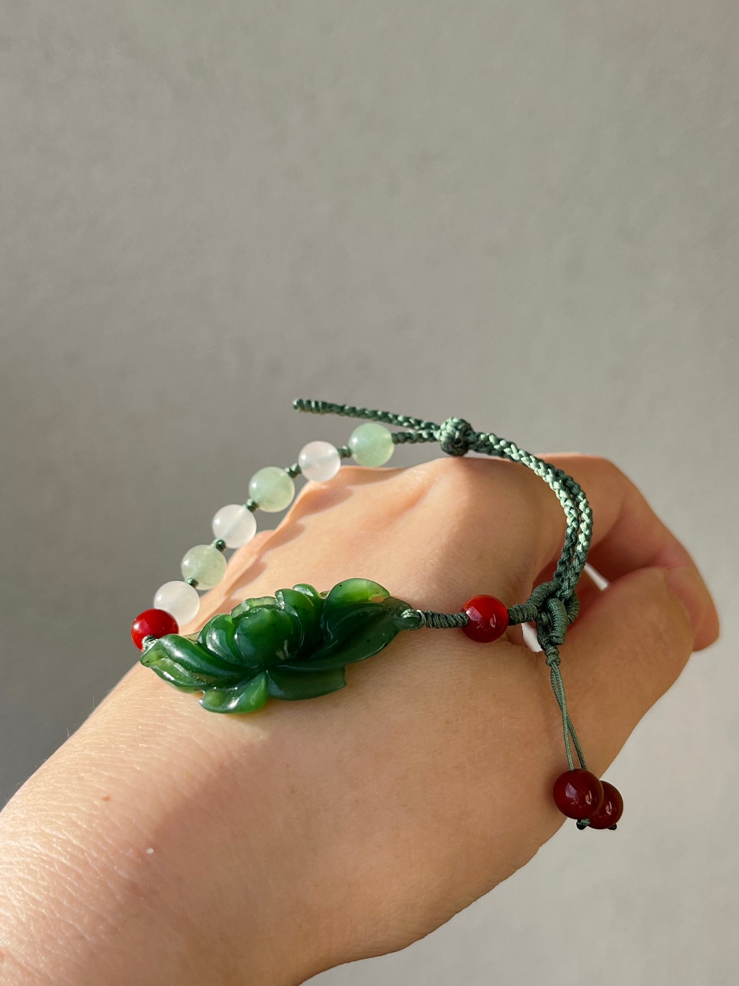 Handwoven Bracelet with a Handcarved Green Jade Lotus Flower, 手编和田碧玉莲花手牌